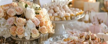 A beautifully arranged wedding favor table with a variety of small gifts, such as personalized keepsakes, sweet treats, and practical items, ready for guests to take home as a token of appreciation for celebrating the couple’s special day. The display is elegantly decorated to match the wedding theme, ensuring guests leave with a memorable and useful favor.