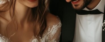 A couple sitting together, holding a wedding gift with no registry, looking happy and surprised as they unwrap it.