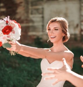 bride tossing bouquet