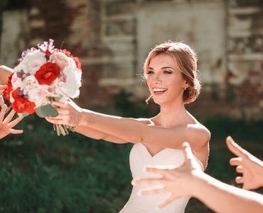 bride tossing bouquet