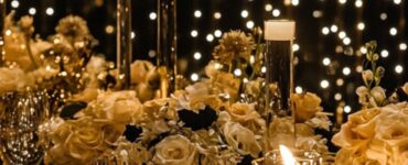 A glamorous wedding setup with elegant decorations, twinkling lights, and a sophisticated black-and-gold theme, creating the perfect atmosphere for a New Year’s Eve celebration.
