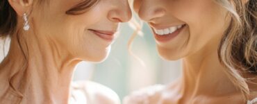 An elegant mother and daughter sharing a heartfelt moment, symbolizing the mother’s role in supporting the bride during wedding planning.