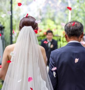 father walking bride down aisle