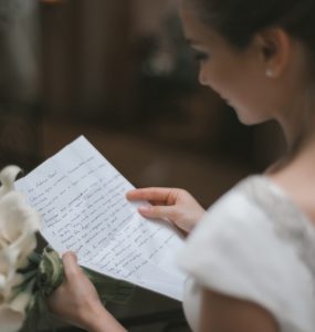 bride reading wedding vows