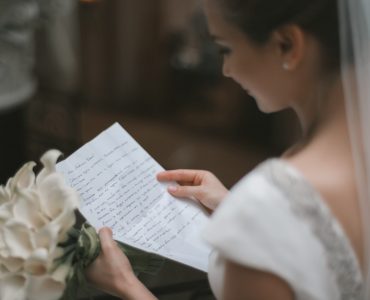 bride reading wedding vows