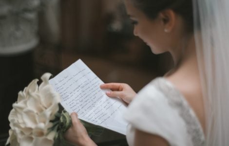 bride reading wedding vows
