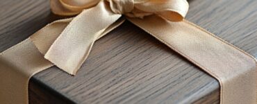 A beautifully wrapped gift box with a wooden theme, symbolizing a traditional five-year wedding anniversary gift.