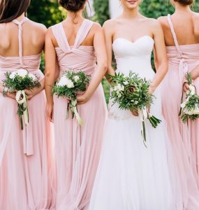 bride and bridesmaids in dresses