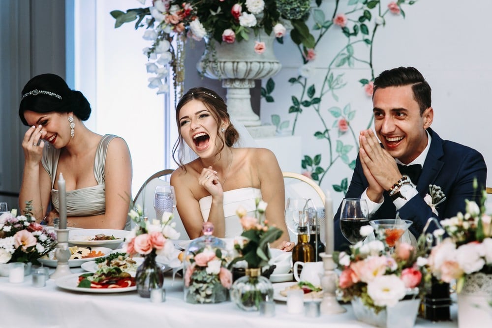 bride and groom laughing