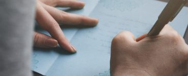 woman writing anniversary card