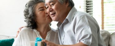 older couple exchanging gifts