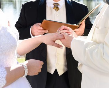 bride, groom, and wedding officiant
