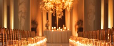 A romantic wedding aisle illuminated by soft, glowing candlelight, creating a warm and elegant atmosphere for the ceremony.
