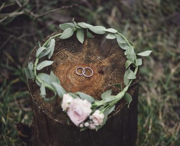 green and gold wedding floral and rings