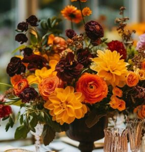 Autumn wedding scene with vibrant fall flowers, showcasing the natural beauty of the season and highlighting the charm of modern greenhouse blooms for a memorable celebration.