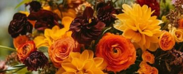 Autumn wedding scene with vibrant fall flowers, showcasing the natural beauty of the season and highlighting the charm of modern greenhouse blooms for a memorable celebration.