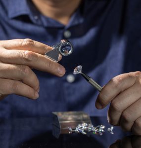 jeweler assessing diamond