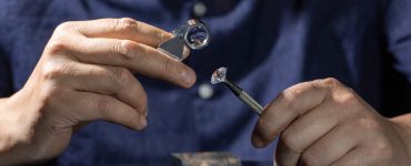 jeweler assessing diamond