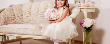 flower girl sitting on couch