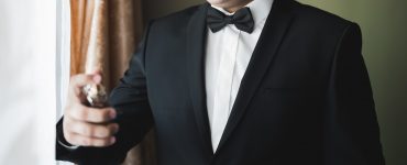 groom posing for photo