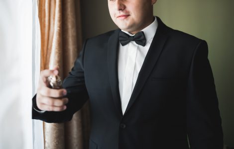 groom posing for photo