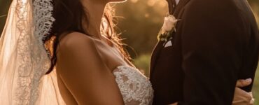 A wedding photographer capturing diverse and creative moments of the special day, beyond just the aisle walk and first dance, showcasing unique and unforgettable memories.