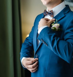 groom wearing blue tux