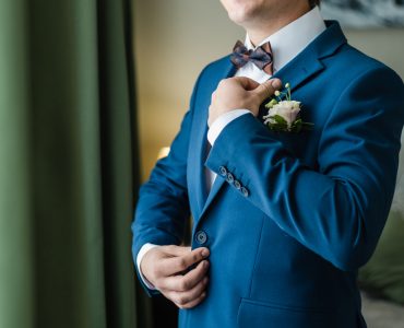 groom wearing blue tux