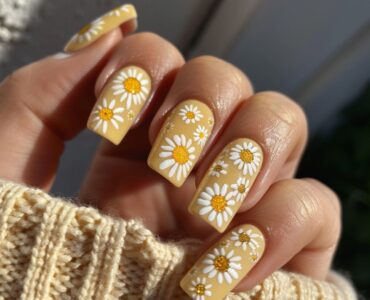 Pale yellow nails with daisy art, featuring cheerful daisy designs on a bright base, ideal for a spring garden wedding.