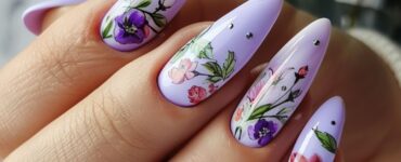 Soft lavender nails with a glossy finish, decorated with floral nail art, ideal for a spring or garden wedding.