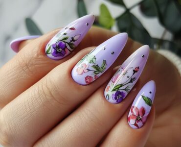 Soft lavender nails with a glossy finish, decorated with floral nail art, ideal for a spring or garden wedding.