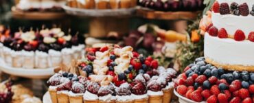 A collection of boho wedding dessert tables showcasing various styles, from rustic and minimalist to vibrant and eclectic, featuring natural elements, vintage accents, and colorful desserts, capturing the free-spirited essence of a boho wedding and adding a memorable touch to your special day.