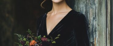 A plush velvet dress, ideal for embracing the rich textures and deep hues of early autumn, perfect for a September wedding.