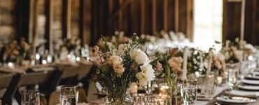 A collection of charming barn wedding table setting ideas, showcasing rustic simplicity, vintage glamour, and whimsical themes, designed to enhance the overall ambiance and reflect personal style for a memorable celebration.