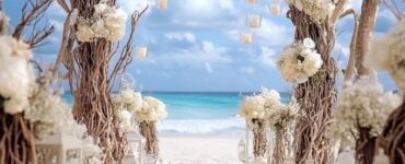 A beautifully decorated beach wedding aisle featuring various decor ideas like driftwood, seashells, and flowers, creating a magical ceremony atmosphere.