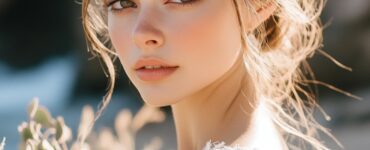 A bride feeling confident and radiant with beach-inspired makeup ideas, ranging from natural to bold looks, perfect for enhancing beauty on her wedding day by the sea.