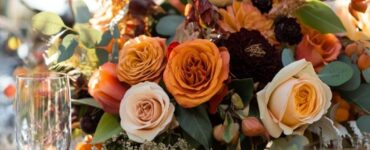 A fall wedding celebration incorporating natural elements, seasonal décor, warm beverages, and interactive entertainment to create a cozy, memorable experience reflecting the magic of autumn.