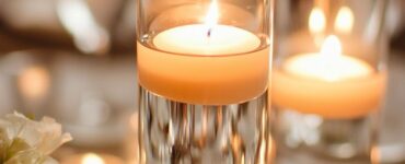 Romantic floating candle centerpiece with a soft, glowing light adding warmth and elegance to a wedding reception table.