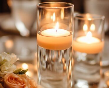 Romantic floating candle centerpiece with a soft, glowing light adding warmth and elegance to a wedding reception table.