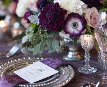 The harmonious blend of plum and silver in wedding decor, attire, and floral arrangements offers a sophisticated and memorable ambiance for a unique celebration.
