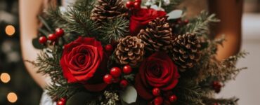 A bride holding a festive Christmas wedding bouquet that reflects her personal style, featuring seasonal elements like red roses, pinecones, and berries, adding a magical touch to her winter celebration.