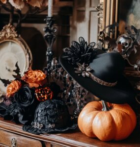 A stylish arrangement of Halloween wedding accessories, illustrating how to blend elegance with festive spirit for wedding guest outfits.