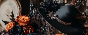 A stylish arrangement of Halloween wedding accessories, illustrating how to blend elegance with festive spirit for wedding guest outfits.