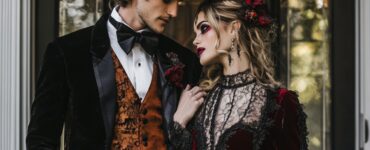 Couple celebrating love at a Halloween wedding, showcasing creative and stylish attire that blends gothic elegance and playful character elements in a festive atmosphere.
