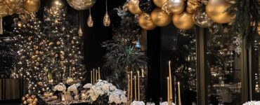 New Year’s wedding celebration setup featuring elegant decor in gold, black, and silver, creating a festive and romantic atmosphere.