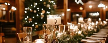 A cozy and magical rustic Christmas wedding setup featuring candlelight, evergreen garlands, and wooden decor for a festive winter wonderland celebration.