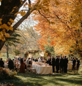 A serene outdoor wedding scene with guests celebrating together amidst autumn foliage, embodying love, gratitude, and the essence of a Thanksgiving-themed wedding.