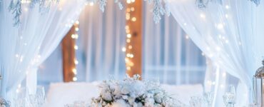 A beautifully decorated winter wonderland wedding featuring frosted décor, winter florals, cozy luxurious touches, and sparkling lights, creating an enchanting and unforgettable experience for guests.