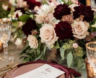 Stunning burgundy color palette with gold, blush, and navy accents, creating an elegant and cozy atmosphere for a winter wedding.
