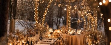 Winter wedding setup with cozy, elegant decor and soft lighting, creating a magical, enchanting atmosphere for a romantic celebration.